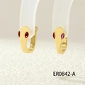 Macro shot of cobra hoop earrings with red gemstone eyes in gold finish detail - ER0842-A/Gold/Red Eyes