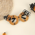 Dettaglio di occhiali da festa di Halloween con glitter arancioni, zucca e ragno decori - Motivo di Zucca