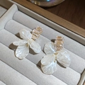 Elegant white floral petal earrings with sparkling baguette rhinestones in gold finish - White Shell Flower