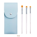 Makeup brush set with 3 orange bristle brushes and a light blue marble-textured handle pouch - Cloud Mist 3Pcs Eye Brush Set