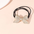 Élastique à cheveux doré avec nœud en strass et cordes tressées noires extensibles - Grand Papillon Strass
