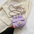 Mini lavender crossbody bag with quilted pattern, bow detail, and gold chain strap - Purple