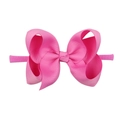 Detail of pink soft ribbon bow on elastic nylon headband for babies and toddlers - Pink