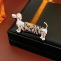 Macro detail of polished dachshund brooch with colorful rope wrapping on leather box - Silver Polished Braided Dachshund Style (34#)