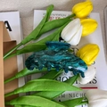 Close-up of deep green marble pattern acrylic hair claw clip with tulip background - Agate Green