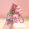 Pink Capybara keychain with strawberry hat, silicone wrist strap and pink bell accessory - Strawberry Pink Capybara PVC