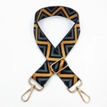 Close-up of retro chevron pattern woven bag strap with golden metal swivel hooks - Dark Gray Black Triangle