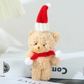 Close-up of plush bear doll with Christmas hat and scarf showing soft fleece texture - 15-18cm / Christmas Blush Brown Red Scarf