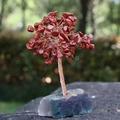 Handmade life tree ornament with red crystal leaves on a natural fluorite base - Red Jasper