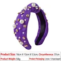 Detail of purple knotted headband with white pearls and gold claw-set crystals on fabric - Purple Artificial Pearl Rhinestone Headband