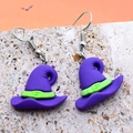 Close-up of purple resin witch hat earrings with green band for Halloween accessory - Hat