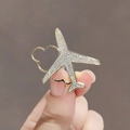Golden airplane brooch with sparkling rhinestones flying over a heart outline shape - 436# Airplane