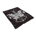 Macro shot of celestial moth flannel blanket with moon phases and zodiac patterns - Black White Astrology Moth