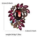 Broche de aleación vintage con diamantes de imitación rojos en un patrón floral - Morado