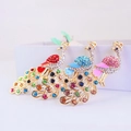 Peacock crystal keychains in red, blue and pink with gold plating and enamel details - Random Color