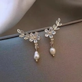 Elegant gold flower and leaf drop earrings with white pearls and sparkling crystals - Gold