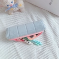 Detailed interior view of grey plush pencil case with pink zipper and stationery storage - Blue (Pink Zipper)