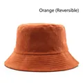 Reversible orange corduroy bucket hat with classic stitched brim in flat front view - Orange (Reversible)