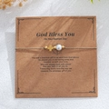 Cross and pearl woven bracelet on a God Bless You gift card for baptism - Cross Style with Baptism Card