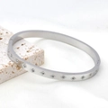 Polished silver stainless steel bangle with star-shaped etchings and inlaid rhinestones - Hexagram / Steel