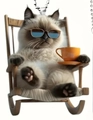 Detailed view of an acrylic cat charm wearing sunglasses on a rocking chair - Sunglasses Coffee Cat