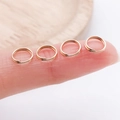 Set of rose gold double split rings for DIY jewelry making shown on fingertips for size scale - Double Layer-0.7x4mm / KC Gold
