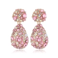 Macro view of teardrop earrings with pink crystals and rhinestones in rose gold base - Clip-on Earrings / Pink