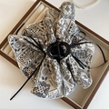 Detail of bohemian paisley print fabric bow hair claw clip displayed in a wooden jewelry box - Claw Clip - White