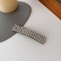 Eleganter rechteckiger Haarclip mit Strassbesatz auf schwarzer Metallbasis - Silber