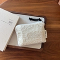 Detail of lace embroidery cotton pouch with simple wish label on a wooden tray - Full Mesh Lace Embroidery