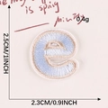 Light blue embroidered letter e patch with gold border for clothing DIY projects - Letter-E