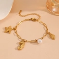 Detailed close-up of golden sea-themed charm bracelet with starfish, seahorse and pearls - Seahorse Starfish Beach Bracelet (T705)