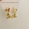 French vintage style gold butterfly stud earrings on a decorative floral display card - Layered French Gold Butterfly