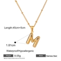 Gold bubble M letter pendant necklace in stainless steel on white background - Letter M