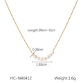 Detail view of gold stainless steel necklace with dimensions 39cm+5cm and small pearls - Curved Pearl Row Style (HC-N40412)