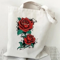 Off-white canvas tote bag featuring vibrant red rose and green leaf tattoo style print - Red Rose Tattoo Style (Off-white)