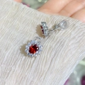 Sparkling silver stud earrings featuring oval red gemstones and clear zircon halo - Clip-On Earrings / Garnet Red