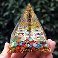 Detailed view of an 8cm crystal pyramid featuring copper coins and a vajra pestle inside - 8cm / Five Emperors Coins