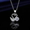 Elegant silver-plated swan pendant necklace featuring a large round cubic zirconia stone - Xl-104