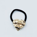 Elegant gold heart-shaped metal hair tie with hand-hammered texture on black band - Hammered Heart Design (Hair Tie 87)