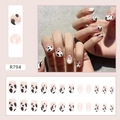 Detail of French style cow print press-on nails with black and white spots on nude pink - Cow Pattern Print (R794)