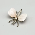Rose quartz butterfly figurine with polished silver metal body on a clean grey background - Rose Quartz