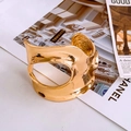 Sculptural gold-plated open cuff bracelet with circular cutout and hammered texture - Gold Irregular Round Hollow