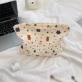 Detailed close-up of quilted Christmas cosmetic bag with festive bear and snowman patterns - Snowman Bear