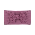 Soft purple nylon baby headband featuring a large bow for comfortable infant hair styling - Deep purple
