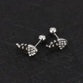 Detailed view of silver fishbone earrings with heart-shaped zircon stones and screw-back - Fishbone - Steel