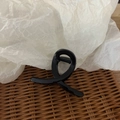 Glossy black hair claw clip with a stylish twisted loop design for women hair styling - Bright Black