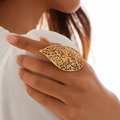 Detailed close-up of a gold hollow leaf-shaped ring with textured patterns on a model - One Size (Adjustable Open) / Light Gold (0784 Hollow Leaf)