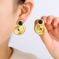 Retro golden spiral earrings featuring a black circular gemstone inlay and geometric style - Black Gold Spiral Vintage Earrings