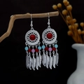 Bohemian silver drop earrings featuring red center beads and feather tassel charms - Red and Blue (E3661)